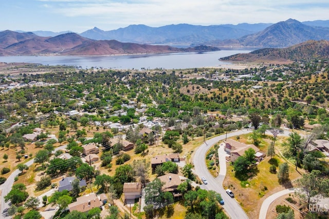 birds eye view of property with a water and mountain view and a residential view