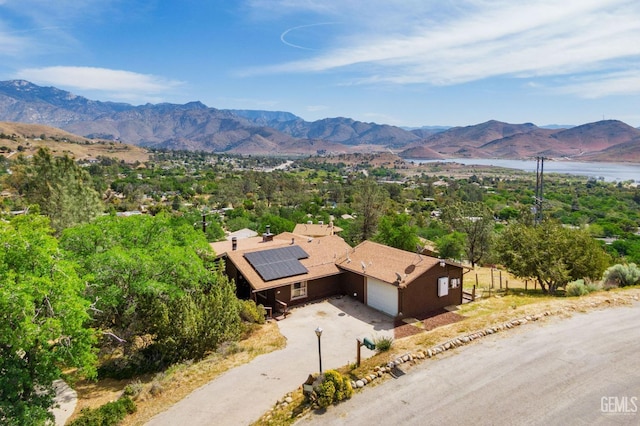 birds eye view of property featuring a mountain view