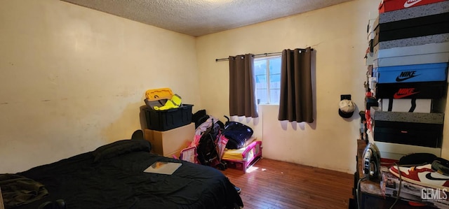 3871 W 109th St Unit 1, Inglewood, CA 90303 - bedroom with hardwood / wood-style floors and a textured ceiling