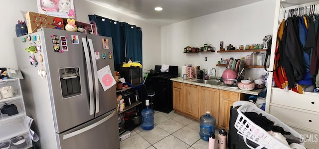 3871 W 109th St Unit 1, Inglewood, CA 90303 - kitchen featuring stainless steel fridge with ice dispenser, a sink, light countertops, light tile patterned flooring, and washer / clothes dryer