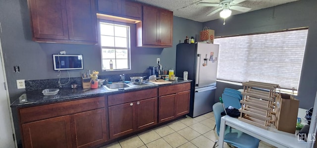 3871 W 109th St Unit 1, Inglewood, CA 90303 - kitchen featuring freestanding refrigerator, a sink, ceiling fan, dark countertops, and light tile patterned floors