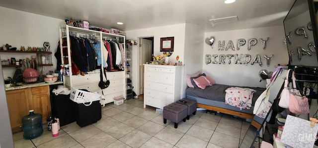 3871 W 109th St Unit 1, Inglewood, CA 90303 - bedroom featuring attic access, light tile patterned floors, recessed lighting, and a closet
