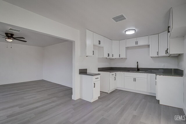 kitchen with white cabinetry and dark hardwood / wood-style flooring