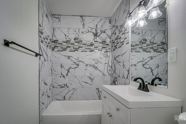 full bathroom with toilet, vanity, tiled shower / bath combo, and hardwood / wood-style flooring