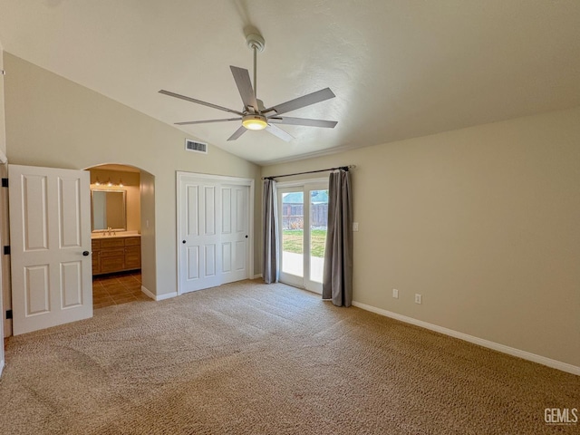 12301 Nacelle Ave, Bakersfield, CA 93312 - unfurnished bedroom with access to outside, light carpet, arched walkways, vaulted ceiling, and ensuite bathroom