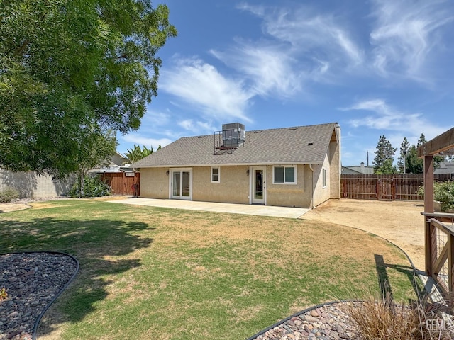 12301 Nacelle Ave, Bakersfield, CA 93312 - back of house with roof with shingles, a patio area, stucco siding, and a fenced backyard