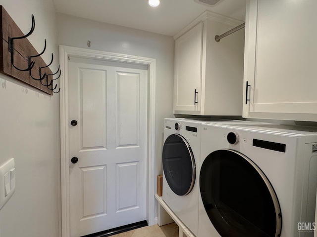 12301 Nacelle Ave, Bakersfield, CA 93312 - washroom featuring washing machine and clothes dryer, cabinet space, and light tile patterned floors