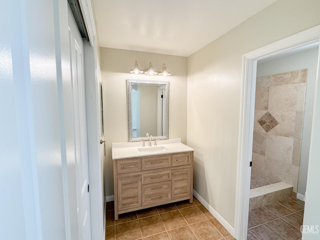 12301 Nacelle Ave, Bakersfield, CA 93312 - bathroom featuring vanity, tile patterned floors, and a tile shower