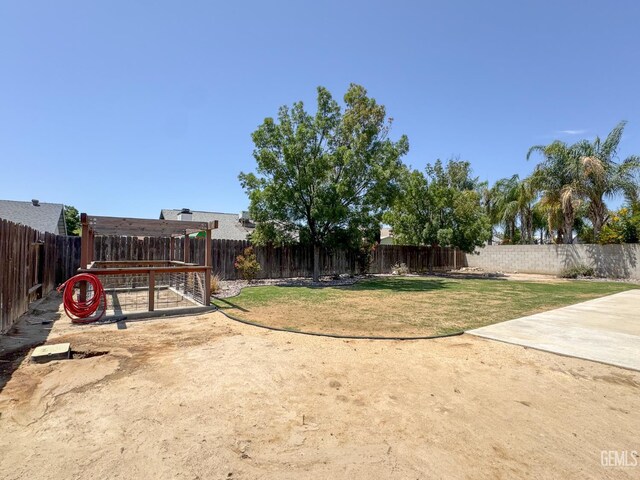 12301 Nacelle Ave, Bakersfield, CA 93312 - fenced backyard with a patio area
