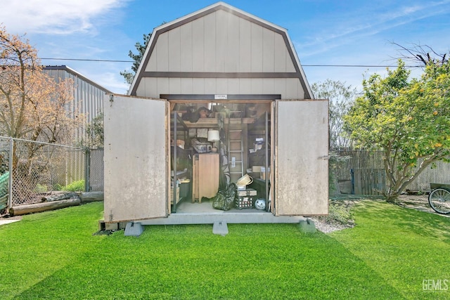 view of outbuilding featuring an outdoor structure and a fenced backyard