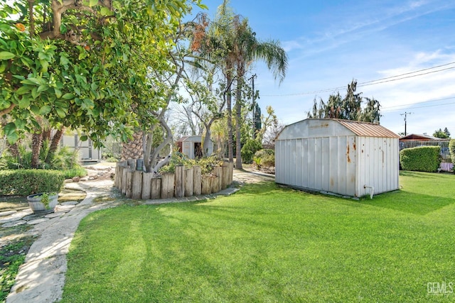 view of yard with a storage shed and an outbuilding