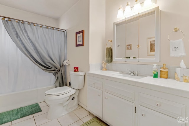 bathroom with vanity, tile patterned floors, shower / bath combination with curtain, and toilet