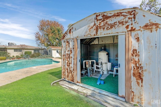 view of shed featuring a fenced in pool