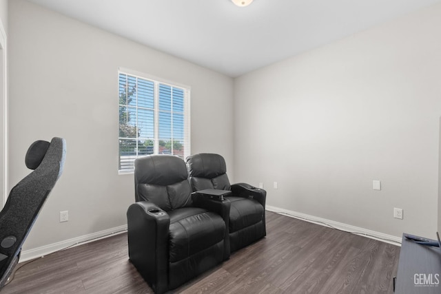 8610 Kowa St, Bakersfield, CA 93314 - sitting room featuring dark wood-type flooring and baseboards