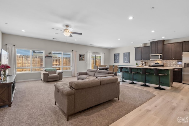 8610 Kowa St, Bakersfield, CA 93314 - living area featuring ceiling fan, recessed lighting, and light wood finished floors