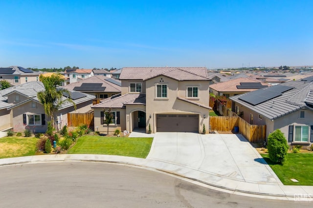 8610 Kowa St, Bakersfield, CA 93314 - mediterranean / spanish home featuring a residential view, a tiled roof, stucco siding, concrete driveway, and an attached garage