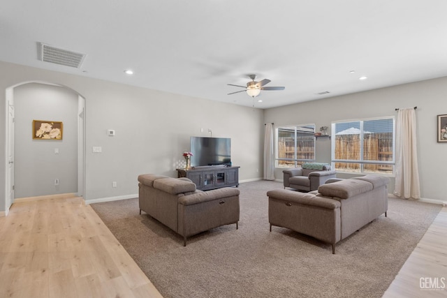 8610 Kowa St, Bakersfield, CA 93314 - living area with arched walkways, a ceiling fan, light wood-style flooring, and recessed lighting