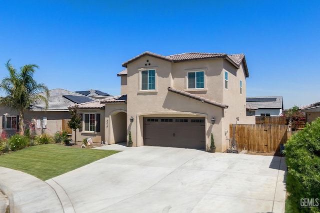 8610 Kowa St, Bakersfield, CA 93314 - mediterranean / spanish-style home featuring stucco siding, a tile roof, concrete driveway, and a garage