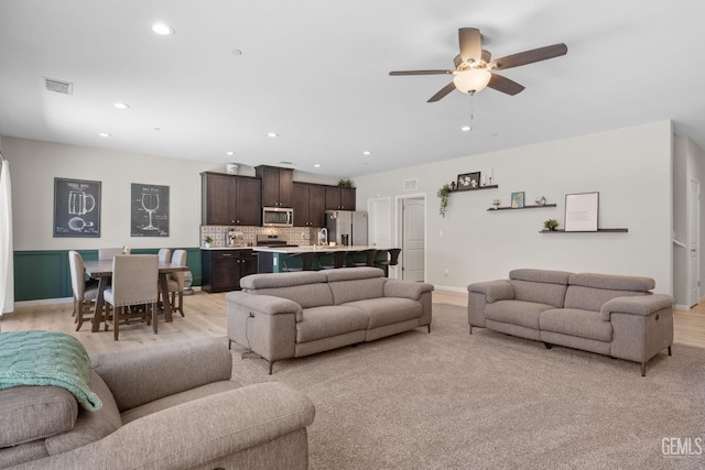 8610 Kowa St, Bakersfield, CA 93314 - living area with a ceiling fan, recessed lighting, and light wood-style floors