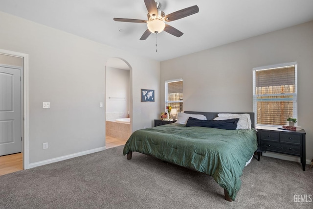 8610 Kowa St, Bakersfield, CA 93314 - bedroom with arched walkways, carpet flooring, ensuite bath, and ceiling fan