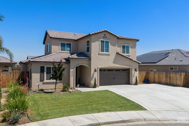 8610 Kowa St, Bakersfield, CA 93314 - mediterranean / spanish-style home featuring stucco siding, a tile roof, driveway, and a garage