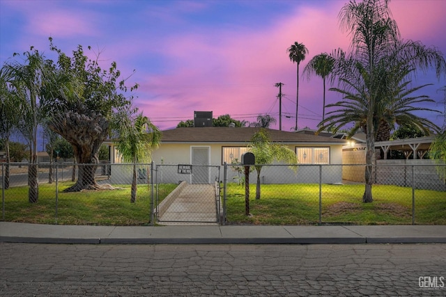 ranch-style home featuring a yard