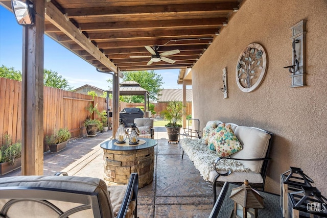 view of patio featuring a gazebo, a ceiling fan, and a fenced backyard