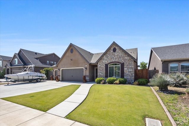 french provincial home with concrete driveway, stone siding, a garage, and stucco siding