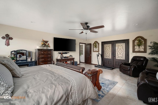 tiled bedroom featuring access to exterior, french doors, and a ceiling fan