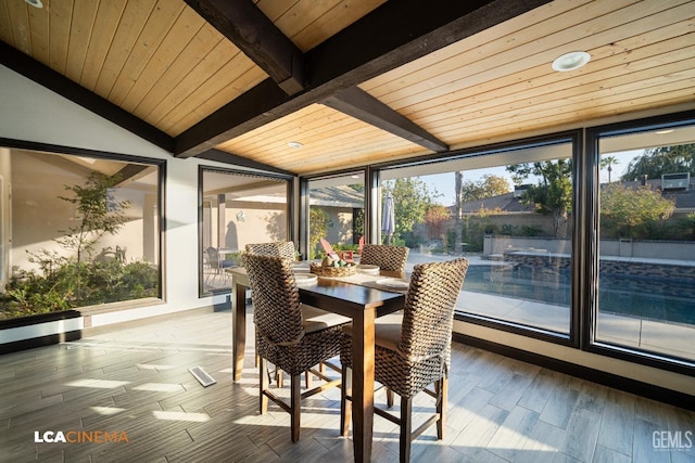 sunroom / solarium with vaulted ceiling with beams and wooden ceiling