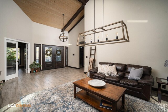 carpeted bedroom featuring access to exterior, ceiling fan, french doors, beamed ceiling, and high vaulted ceiling