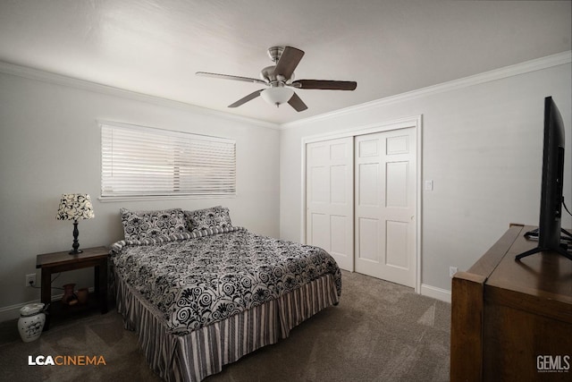 carpeted bedroom with a closet, ceiling fan, and crown molding