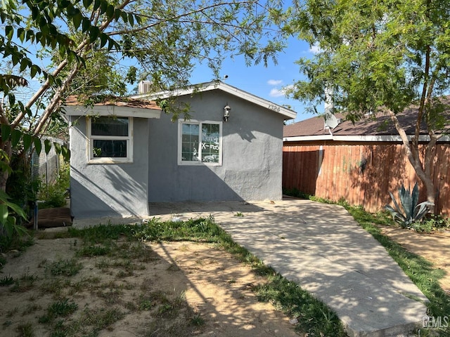 rear view of property with a patio area