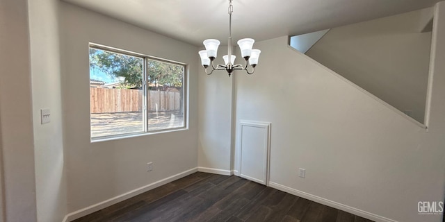 8808 Cape Flattery Dr, Bakersfield, CA 93312 - unfurnished dining area with dark wood-style floors and a chandelier
