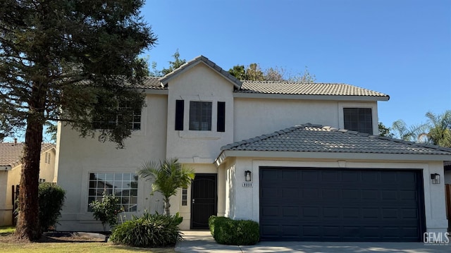8808 Cape Flattery Dr, Bakersfield, CA 93312 - view of front of home featuring a tile roof, stucco siding, a garage, and driveway
