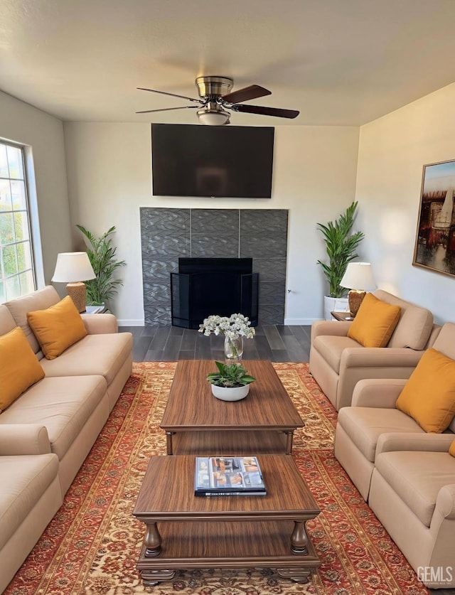 8808 Cape Flattery Dr, Bakersfield, CA 93312 - living room featuring wood finished floors, ceiling fan, and a tile fireplace