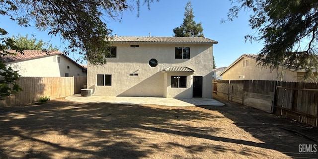 8808 Cape Flattery Dr, Bakersfield, CA 93312 - rear view of property with stucco siding, a fenced backyard, a patio area, and a tile roof
