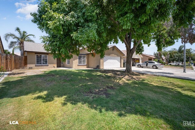 3400 Tori Lorene Ave, Bakersfield, CA 93313 - ranch-style home with stucco siding, a garage, concrete driveway, and a tile roof