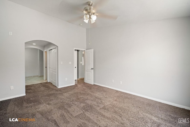 3400 Tori Lorene Ave, Bakersfield, CA 93313 - empty room with a ceiling fan, arched walkways, and carpet floors