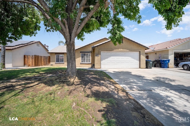 3400 Tori Lorene Ave, Bakersfield, CA 93313 - single story home with driveway, stucco siding, an attached garage, and a tiled roof