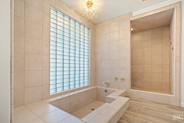 7108 Luke Ave, Bakersfield, CA 93308 - bathroom with wood finished floors and a chandelier