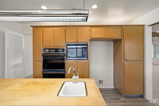 7108 Luke Ave, Bakersfield, CA 93308 - kitchen featuring built in microwave, a sink, dark wood-style floors, and recessed lighting