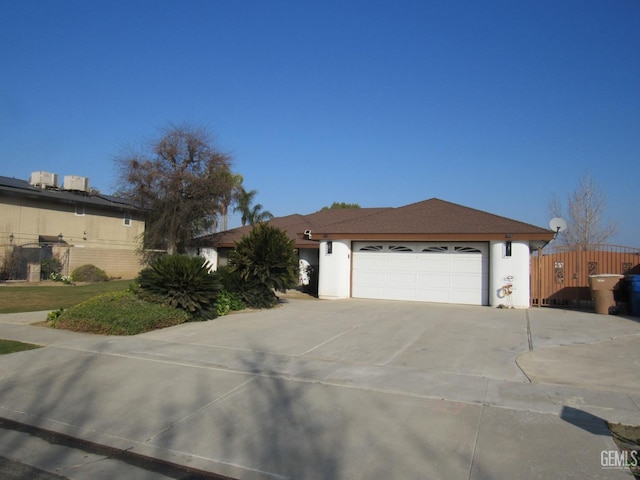 single story home featuring a garage