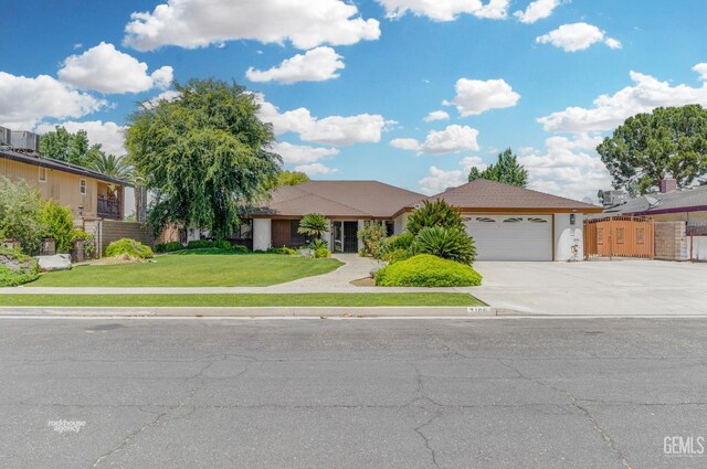 7108 Luke Ave, Bakersfield, CA 93308 - ranch-style home featuring an attached garage and driveway