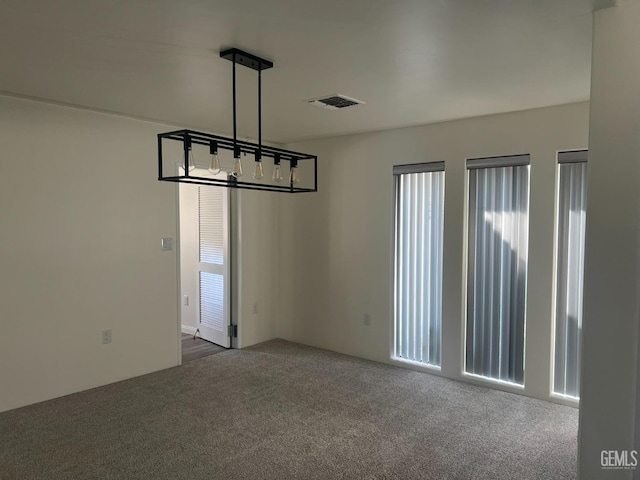 unfurnished dining area with carpet and a healthy amount of sunlight