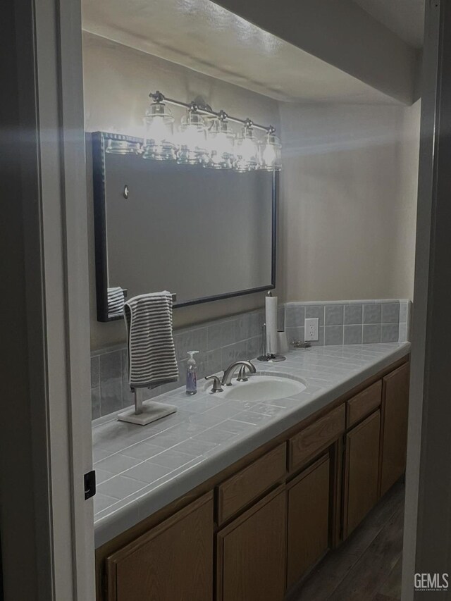 bathroom with vanity and wood-type flooring