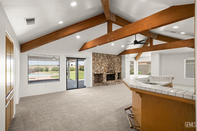 7108 Luke Ave, Bakersfield, CA 93308 - carpeted living area with a sink, a stone fireplace, a ceiling fan, and recessed lighting