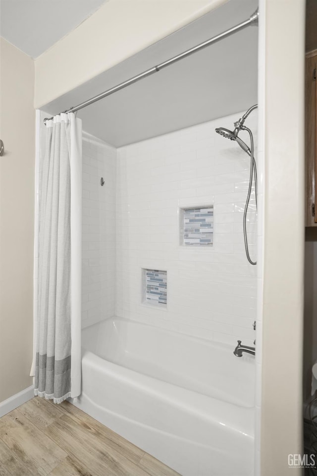 7108 Luke Ave, Bakersfield, CA 93308 - full bath featuring wood finished floors and shower / bath combo