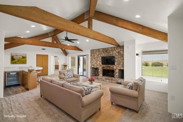 7108 Luke Ave, Bakersfield, CA 93308 - living room with beverage cooler, recessed lighting, a fireplace, ceiling fan, and light wood-style flooring
