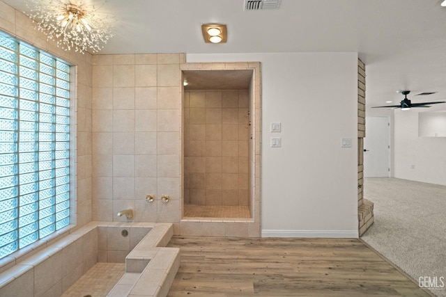 7108 Luke Ave, Bakersfield, CA 93308 - full bathroom with plenty of natural light, a chandelier, a garden tub, and a ceiling fan